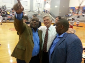 Rep. Reginald Murdock (Marianna) points while Gov. Mike Beebe and Real Deal co-founder Bill Ingram look on